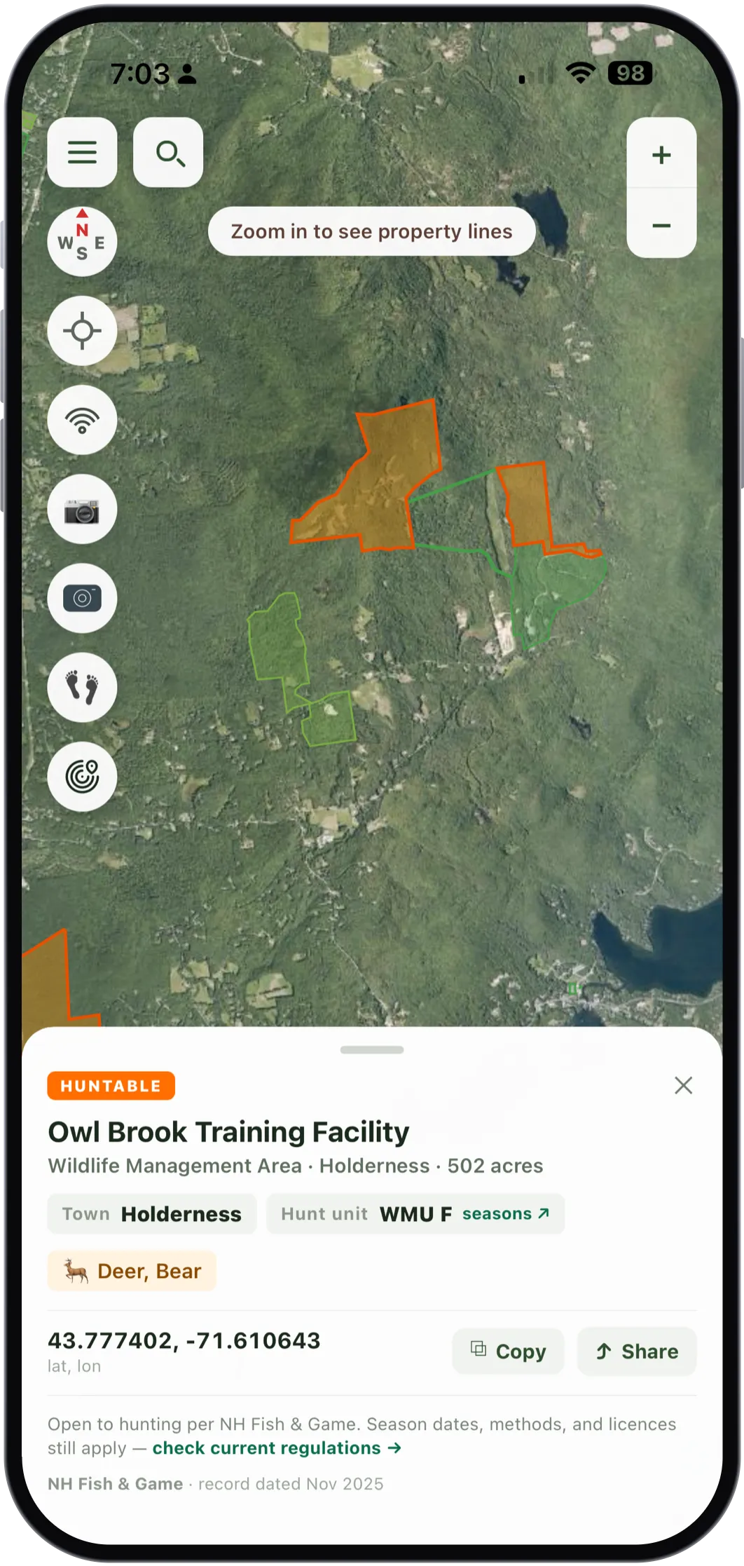 The card for Owl Brook Training Facility on aerial imagery, with the area outlined in orange. It reads HUNTABLE, Wildlife Management Area, Holderness, 502 acres, town Holderness, hunt unit WMU F with a link to the seasons, managed for Deer and Bear, coordinates 43.777402 and -71.610643 with copy and share buttons, open to hunting per NH Fish and Game with season dates, methods and licences still applying, record dated November 2025.