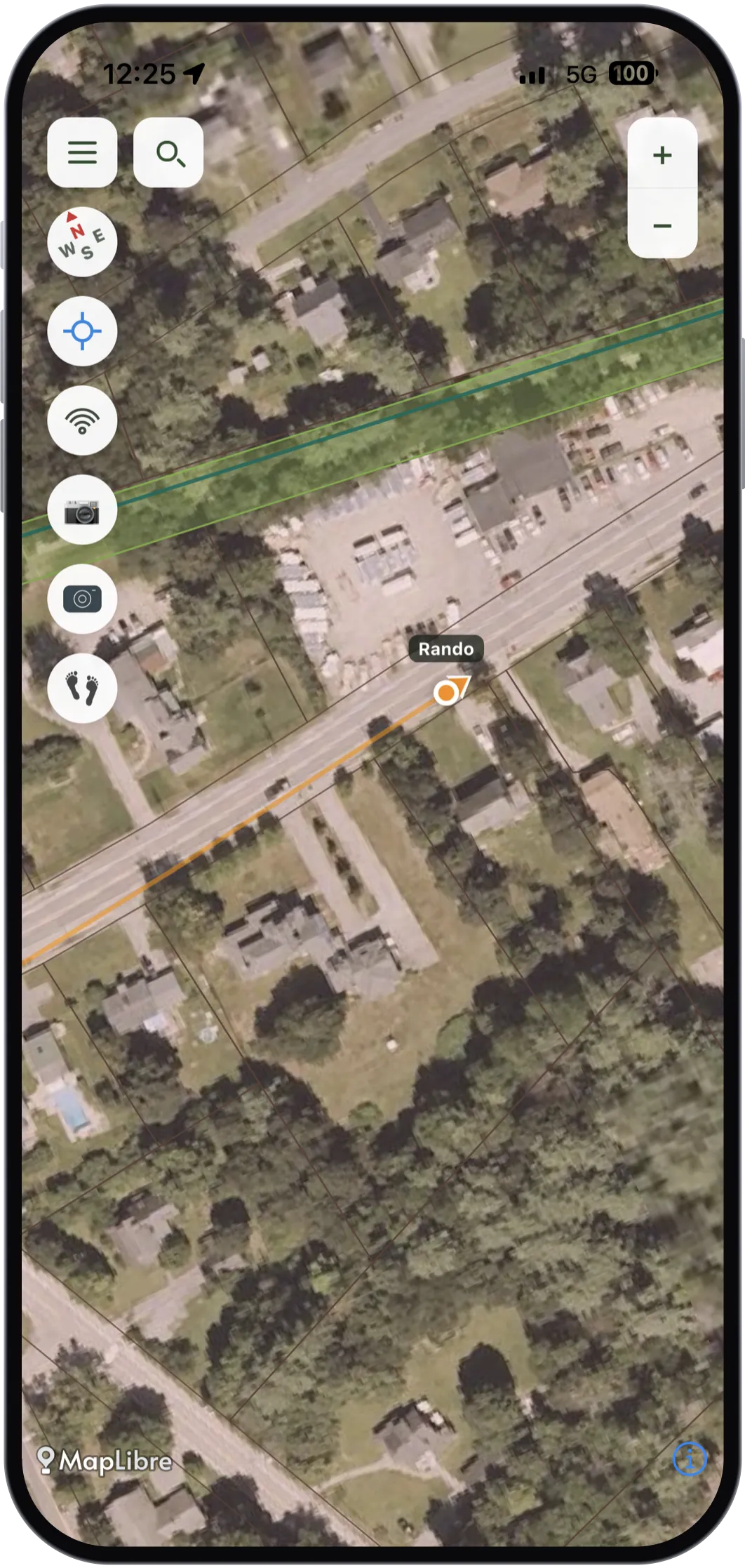 Brow Tine zoomed in on aerial imagery: a party member labelled Rando drawn as an orange marker with a heading arrow, trailing a short orange breadcrumb line back along the road he came in on.