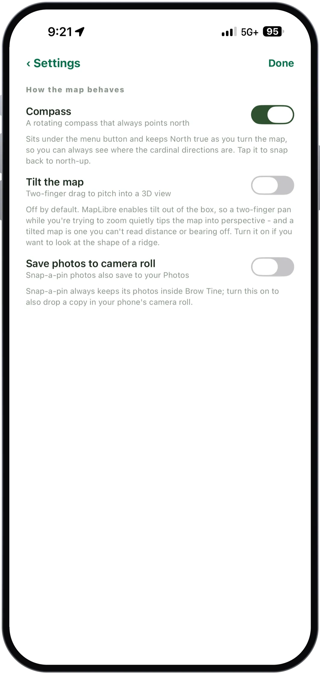 The Settings screen with toggles for the compass, tilting the map and saving snap-a-pin photos to the camera roll, each with a paragraph explaining what it does and why.